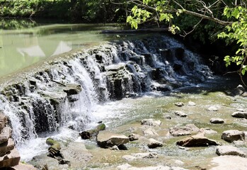 The waterfall in the park on a sunny day