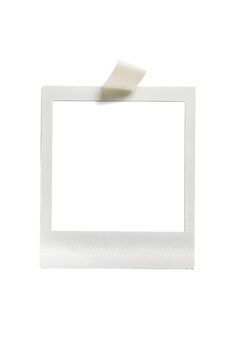 Vintage Memory Snapshot: A blank, classic instant photo frame, affixed with a piece of tape, offering a nostalgic glimpse into moments, a blank canvas ready for your unique touch.