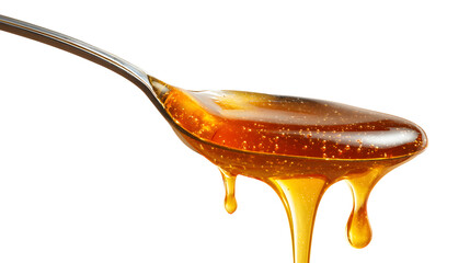 Honey dripping from a spoon isolated on a white background