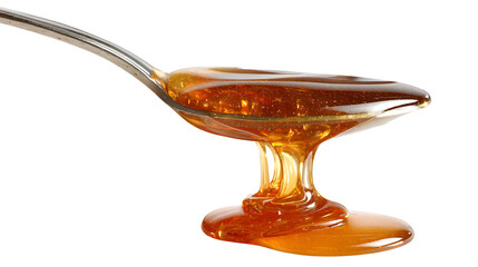 Honey dripping from a spoon isolated on a white background