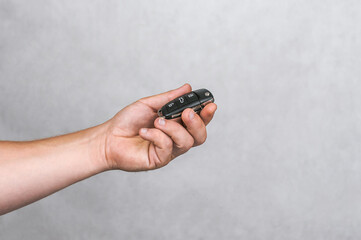 Car Key Security: Hand Holding Modern Vehicle Remote