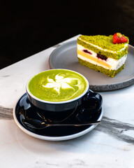 Matcha Latte with Green Cake on Marble Table – Cozy Artisan Café Scene
