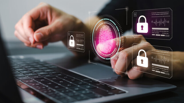 A hand interacts with a glowing pink fingerprint scan on a holographic interface amid dark purple panels and blurred laptop keyboard background