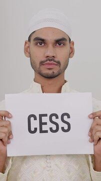 Vertical Video of Muslim Man Holding CESS Poster