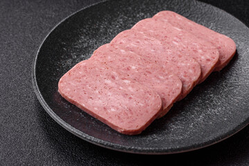 Food, meat, ham sliced in slices for the festive table. Spiced ham