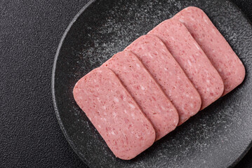 Food, meat, ham sliced in slices for the festive table. Spiced ham