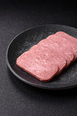 Food, meat, ham sliced in slices for the festive table. Spiced ham