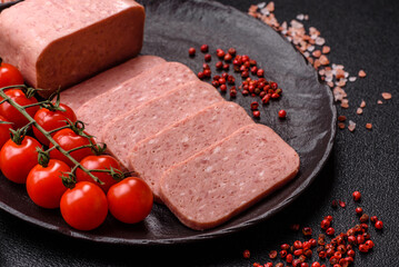 Food, meat, ham sliced in slices for the festive table. Spiced ham
