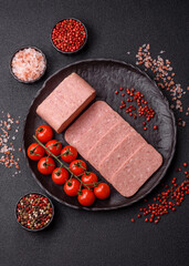 Food, meat, ham sliced in slices for the festive table. Spiced ham