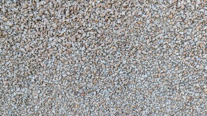 Textured gravel surface for landscaping and construction with neutral colors 