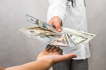 Children's Pocket Money: Hand Giving Dollars for Financial Literacy.
