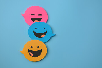 colorful speech bubbles with smiles, a concept of fun communication and correspondence