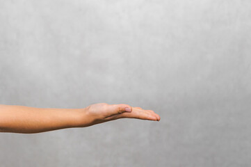 Child's Open Hand Gesture: Offering, Receiving, and Empty Space