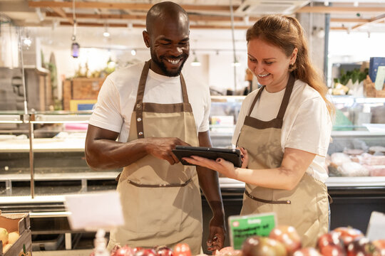 Friendly interaction in a green eco store setting - Powered by Adobe