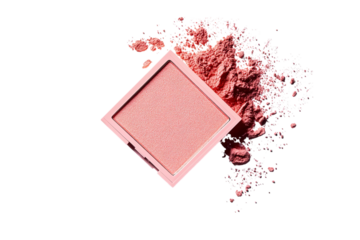 A square-shaped pink blush compact lying on its side, with powder dust scattered around it, set against a white isolated on a transparent background in PNG format.