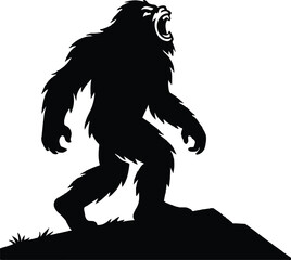 Silhouette of a roaring Bigfoot Yeti with outstretched arms on a rocky outcrop
