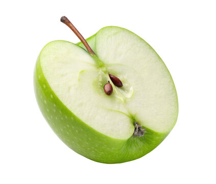 Sliced green apple with visible seeds and a brown stem isolated on a clean black background