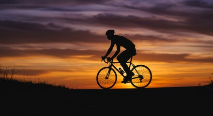 Fototapeta premium Cyclist silhouette at sunset