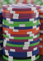 Stack of Colorful Casino Chips - A close-up shot of a neatly stacked pile of colorful casino chips, showcasing vibrant hues and intricate designs