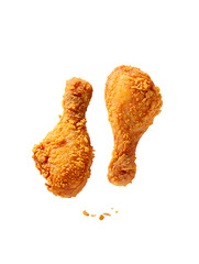 Two golden brown crispy fried chicken drumsticks on image