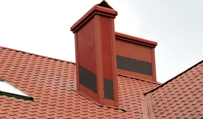 Chimney on the roof of the house.