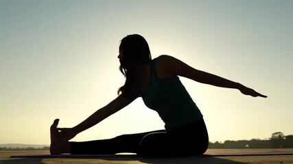 Silhouette of Woman Practicing Yoga at Sunrise Find Your Inner Peace and Flexibility