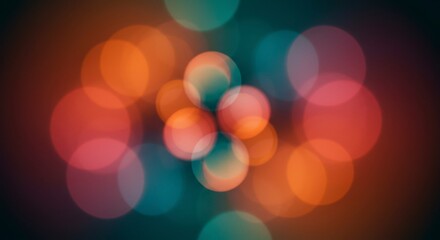 Abstract image of blurred, colorful lights forming a symmetrical pattern.  Warm and cool tones blend