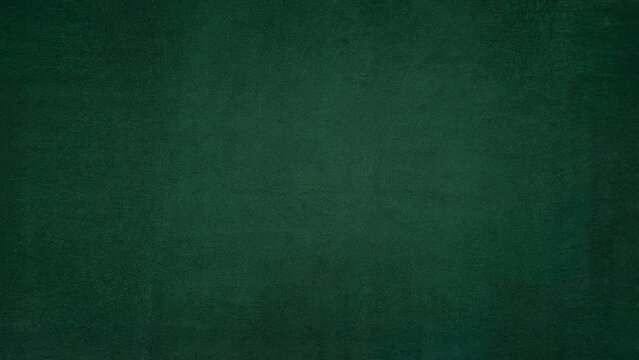 A deep textured emerald green background with subtle variations in shade and a slightly rough surface perfect for design