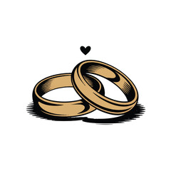 Two golden wedding rings with a small heart isolated on white background