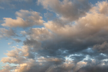 Cloud formation with varying shades during sunset over a vast sky in a tranquil atmosphere