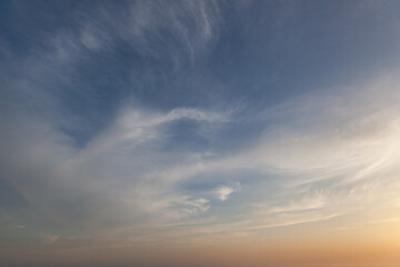 Colorful sunset sky with soft clouds over a peaceful horizon