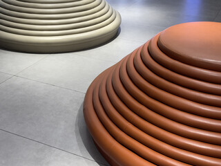 Modern round tiered leather seats in contemporary interior space
