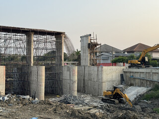 Dam construction site with concrete structure and excavators