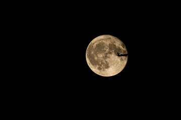 Air plane full moon. A photograph of a jet airplane in the moon. 