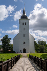 Pathway Leading to White Historic Church with Steeple on Sunny Day &ndash; Christian Landmark and Spiritual Symbolism