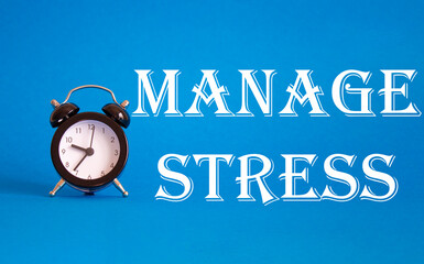 Manage stress symbol. Concept word Manage stress on Beautiful blue background with alarm clock....