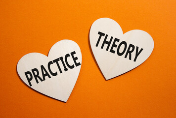 Theory or Practice symbol. Concept word Theory or Practice on wooden hearts. Beautiful orange...
