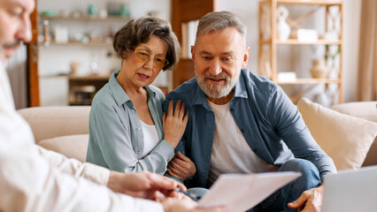 Reaching an agreement. Happy spouses visiting realtor to buy real estate, signing insurance policy, financial deal with bank manager