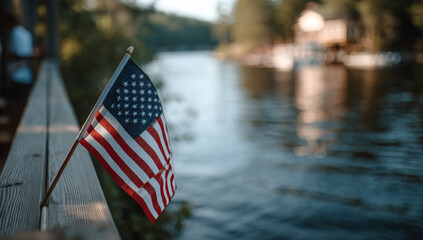 American Flag Displayed on a Wooden Pier Beside a Calm Lake During Golden Hour

