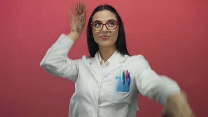 Woman celebrating in laboratory uniform against vibrant red backdrop symbolizes scientific success...