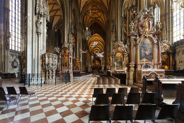 Interior of St. Stephen’s Cathedral in Vienna with Gothic architecture and altars