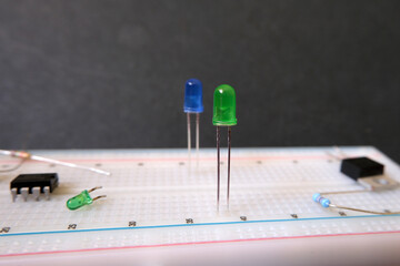 Electronic learning on the breadboard. Focused on green led. 