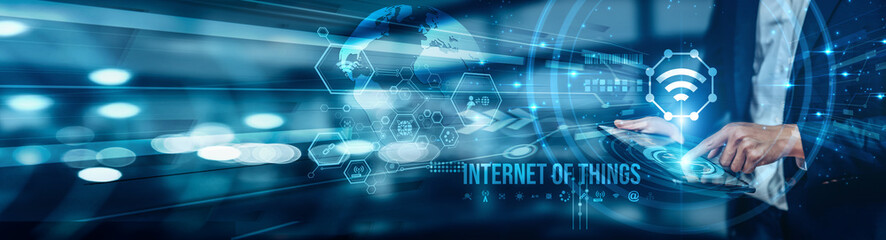 Businessman using tablet analyzing Internet of Things connectivity to monitor smart devices, collect real-time data, optimize operations, automation, improve decision-making, and drive digital growth.