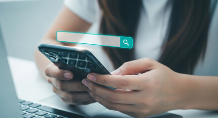Close-up of hands holding smartphone with a search bar graphic above, illustrating online search concept, ideal for digital marketing or technology websites