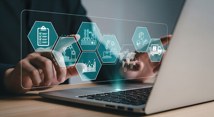 Hands interacting with a digital interface showing supply chain management icons on a laptop, symbolizing automation, efficiency, and global logistics in business operations
