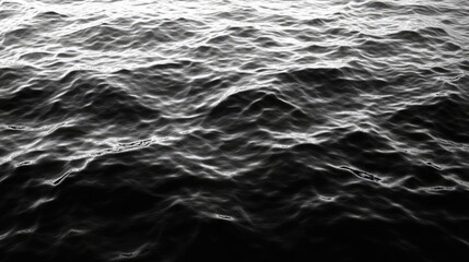 Close-up view of a textured water surface in grayscale.