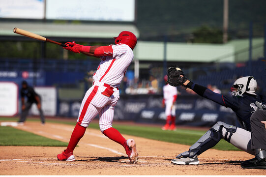 red baseball guy hitting