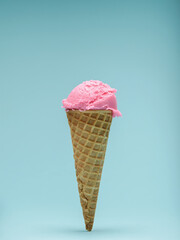 Pink Ice Cream cone isolated on blue background