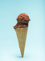Chocolate Ice Cream Cone. Isolated on Blue Background.