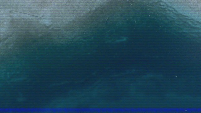 Fixed view revealing dark teal water surface rippling with faint noise lines, analyzing texture